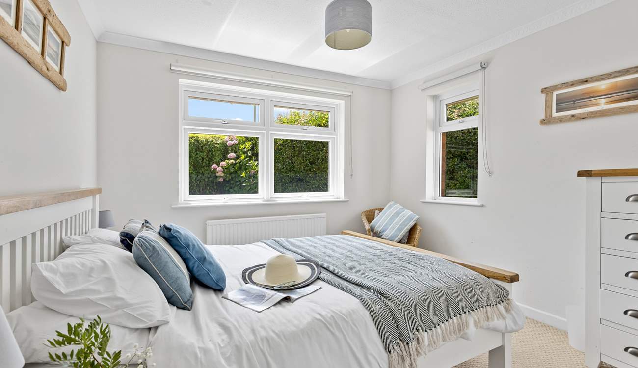 This bedroom has dual-aspect windows which look out into the garden. 