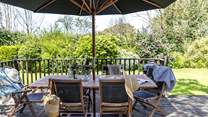 The garden is an oasis with the beach a short walk from the back garden gate.