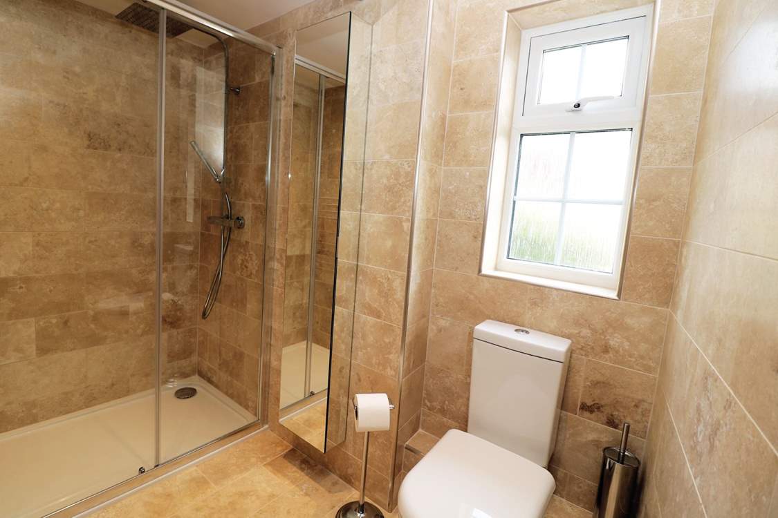 The principal bedroom has an en suite shower-room.