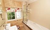 The family bathroom has a bath with fitted shower.  - Thumbnail Image