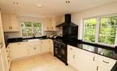The separate kitchen has all the equipment you'll need on holiday.  - Thumbnail Image