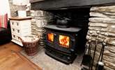 Warm your toes by the wood-burner.  - Thumbnail Image