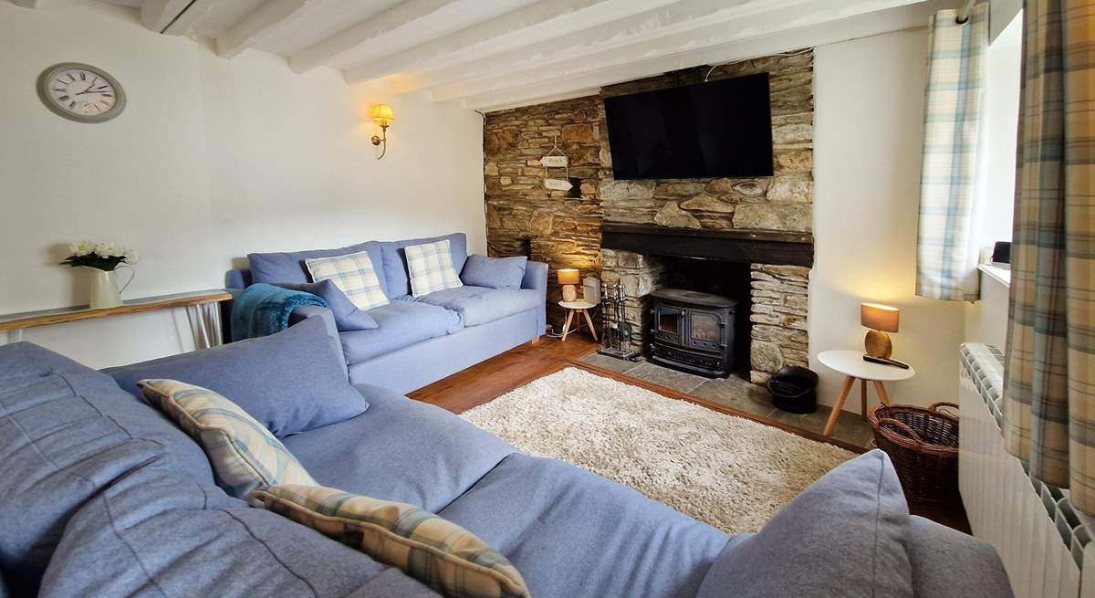 The cosy sitting-room has a wood-burner to keep you warm throughout the seasons. 