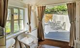 Fling open the French doors in bedroom one and step out on to the decked terrace. - Thumbnail Image