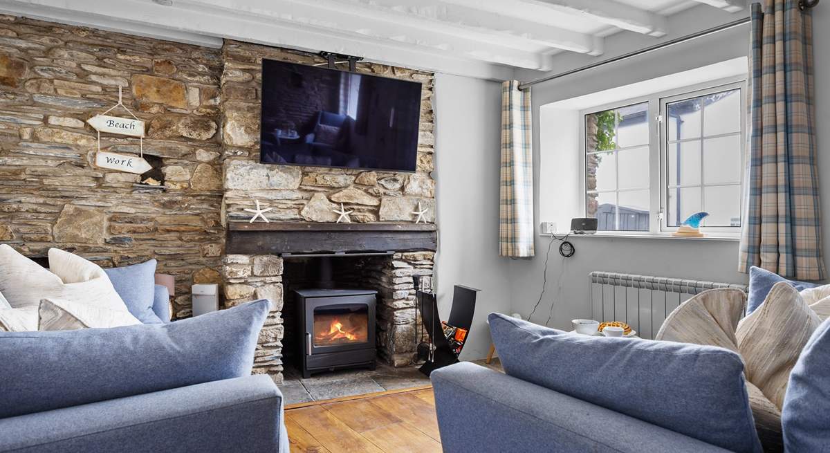 The cosy sitting-room has a wood-burner for those chillier seasons.