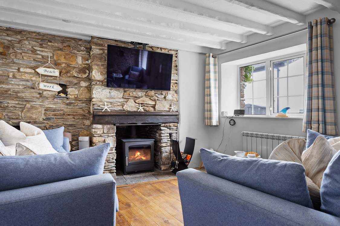 The cosy sitting-room has a wood-burner for those chillier seasons.