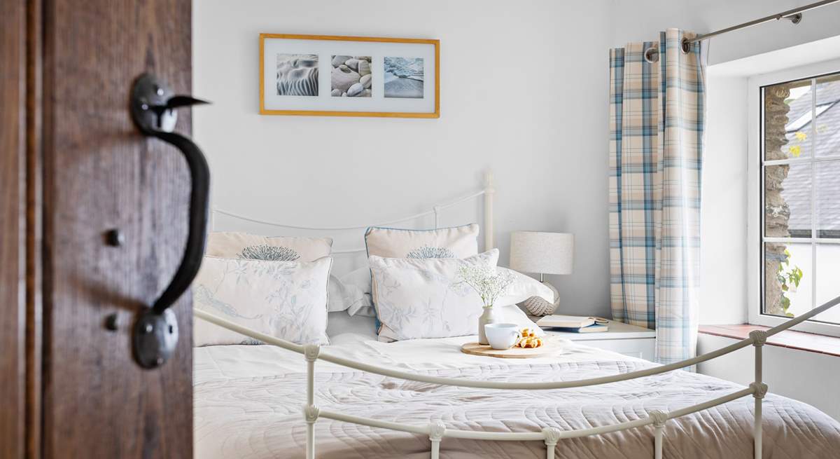 Light and airy bedroom two has a double bed.