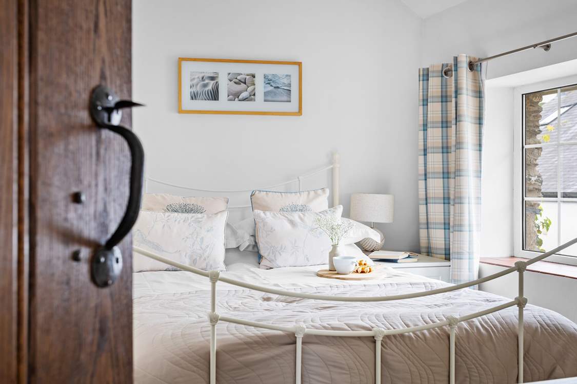 Light and airy bedroom two has a double bed.
