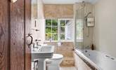 Rinse off those sandy toes in the family bathroom or unwind in a relaxing bubble bath after a busy day. - Thumbnail Image