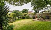 The pretty garden is perfect for al fresco dining. - Thumbnail Image