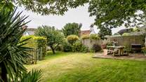 The pretty garden is perfect for al fresco dining.