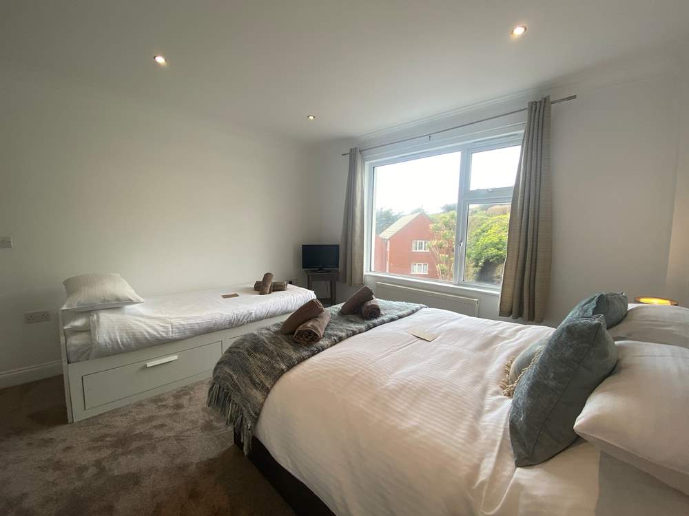 Bedroom 3 has a double bed and single bed with pull-out trundle bed.