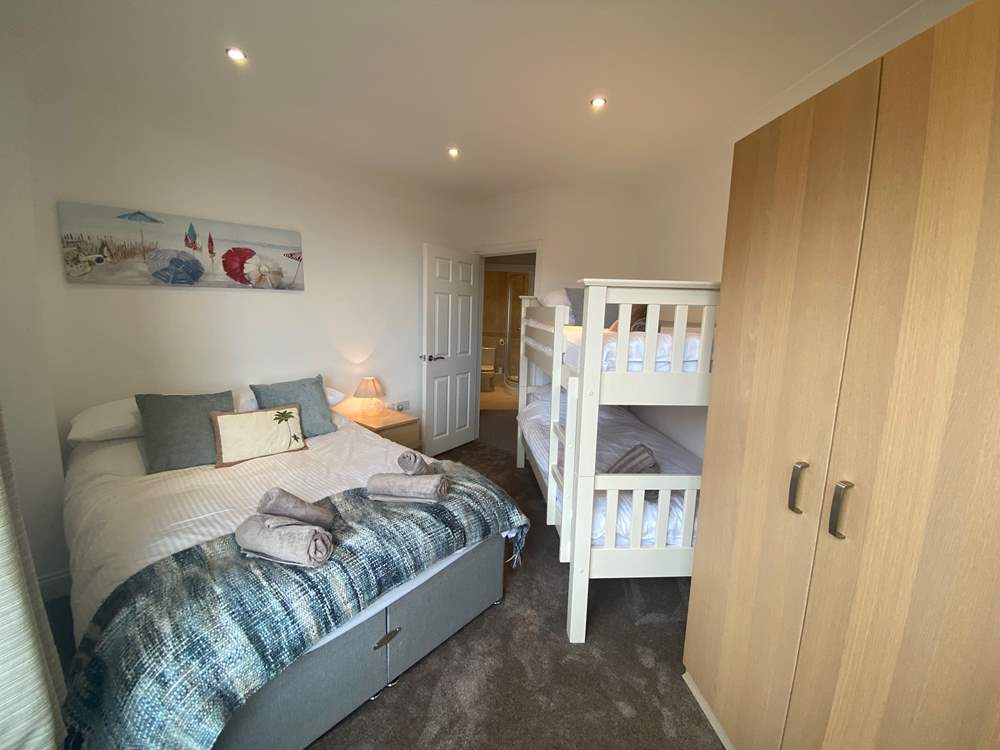 Bedroom 2 has a double bed and bunk-beds.