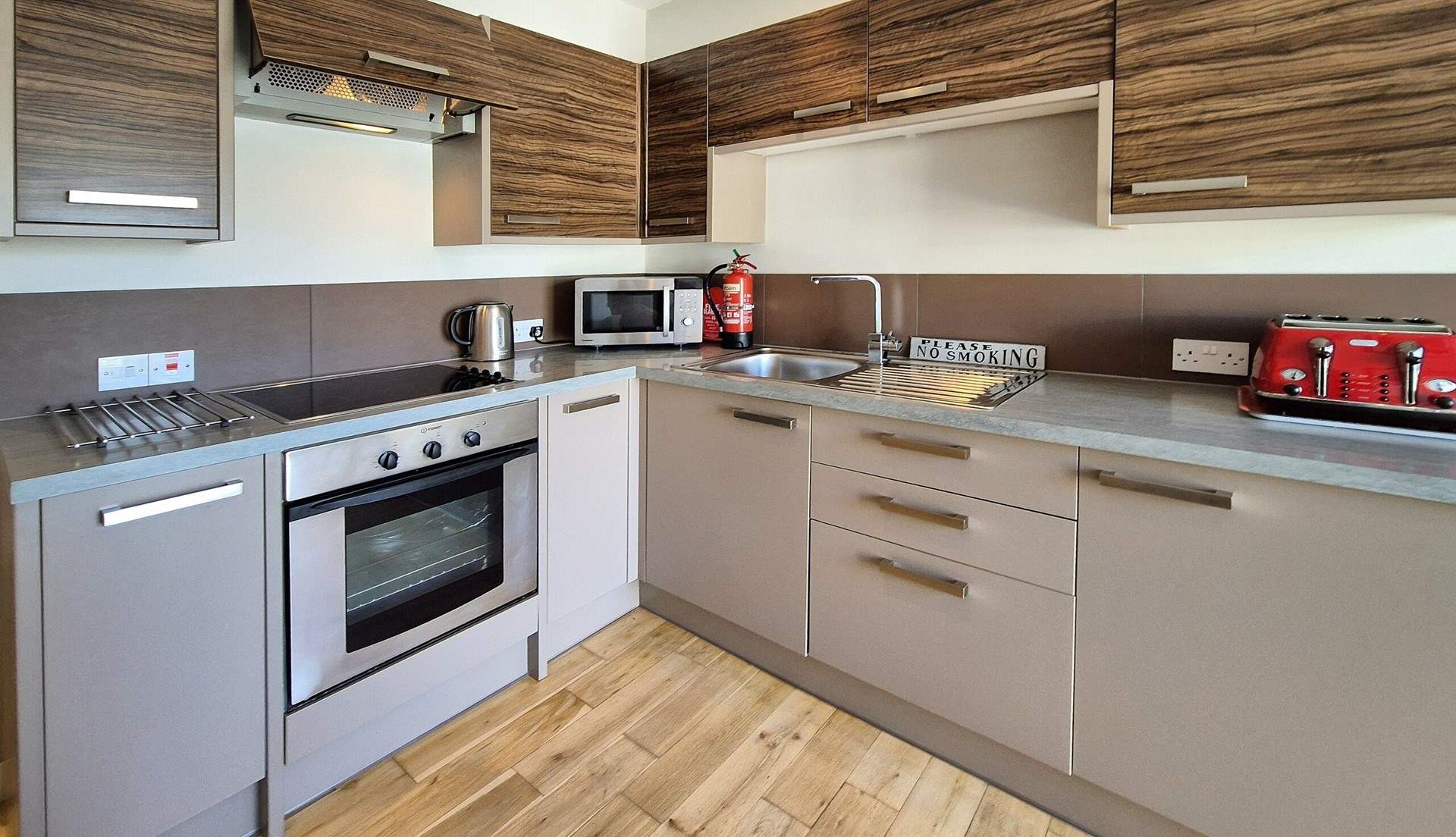 The kitchen area comes well-equipped and even has a dishwasher. 