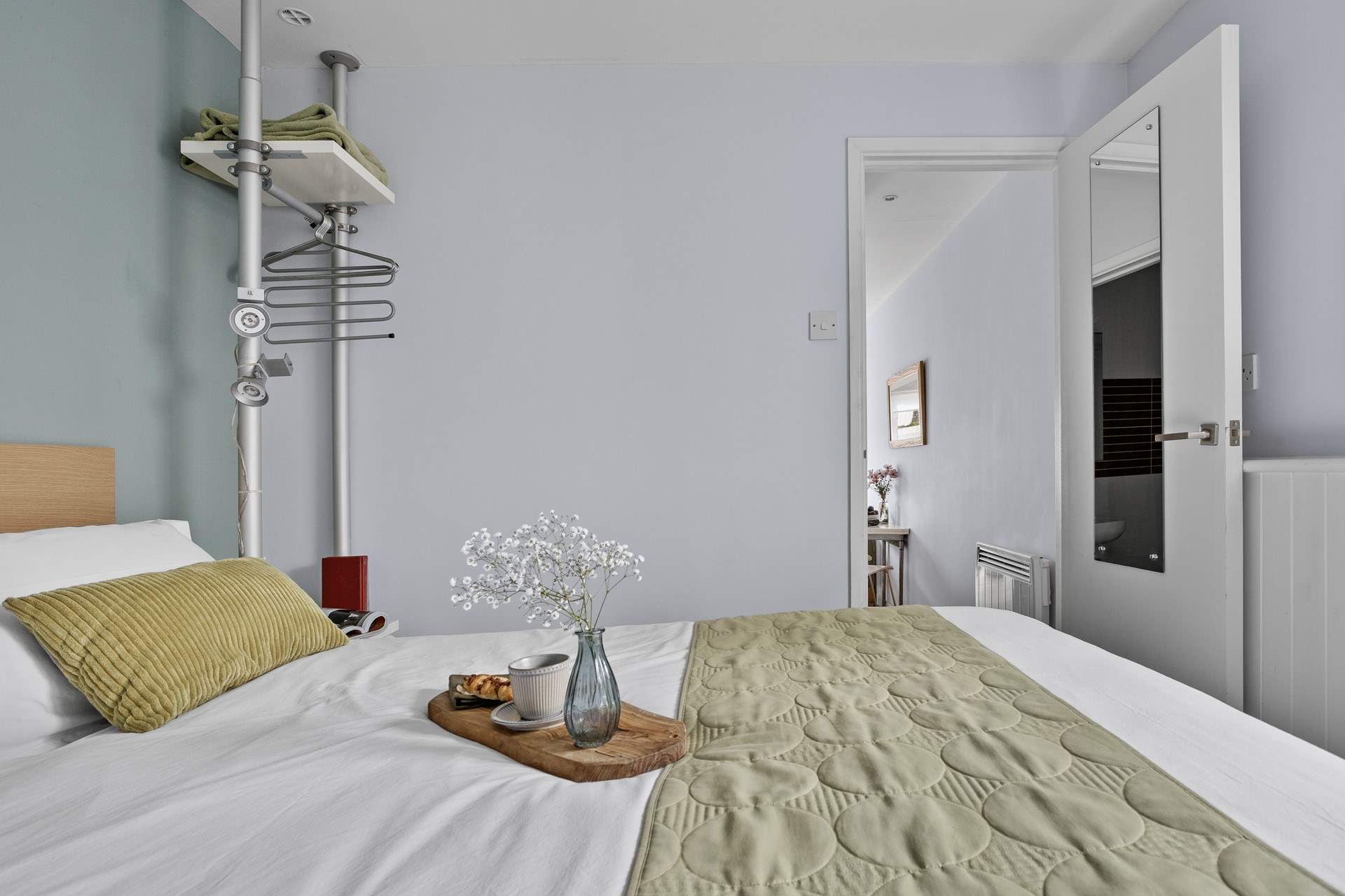 The bedroom is just off the living space.