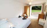 The double bedroom on the ground floor has doors leading out onto the patio. - Thumbnail Image