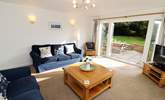 The sitting-room has French doors into the garden.  - Thumbnail Image