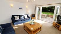 The sitting-room has French doors into the garden. 