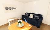 Relax in the sitting-room after a busy beach day. - Thumbnail Image