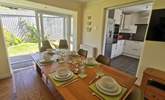 The dining-area has patio doors leading into the garden.  - Thumbnail Image