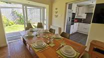 The dining-area has patio doors leading into the garden. 
