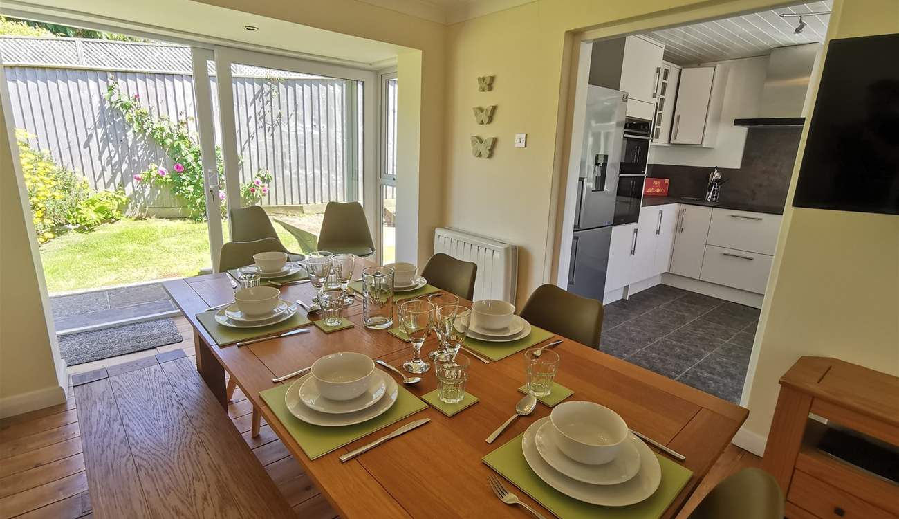 The dining-area has patio doors leading into the garden. 