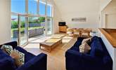 The stylish open plan living space leads out onto the sunny patio.  - Thumbnail Image