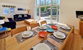 Gather everyone around the table to chat about the adventures of the day.  - Thumbnail Image