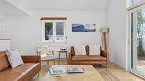 The stylish sitting area offers the best spot for the family to come together and plan the next beach day.
