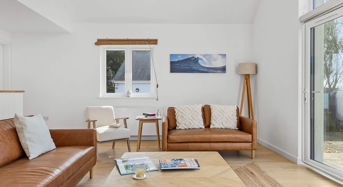 The stylish sitting area offers the best spot for the family to come together and plan the next beach day.
