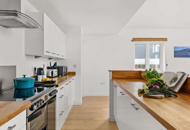 The fully equipped kitchen awaits your arrival.