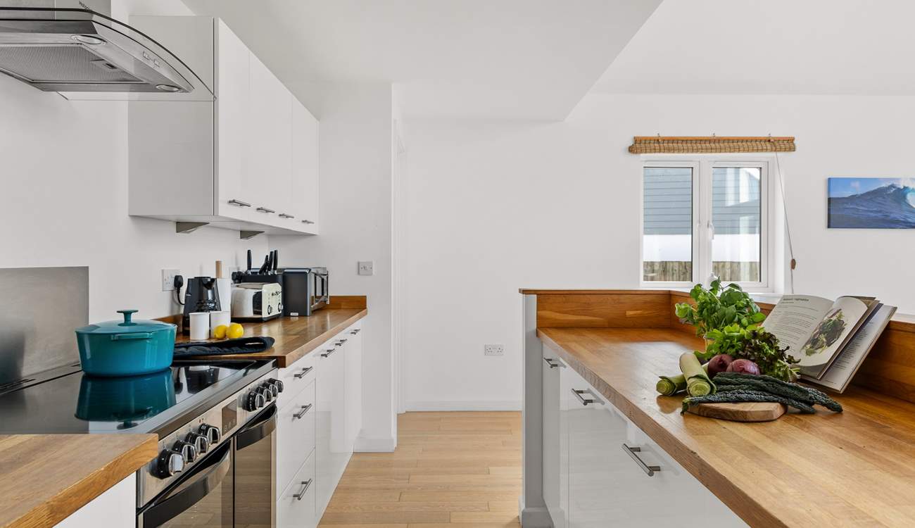 The fully equipped kitchen awaits your arrival.