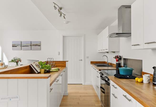 The open plan kitchen is equipped and ready to whip up a family banquet.  