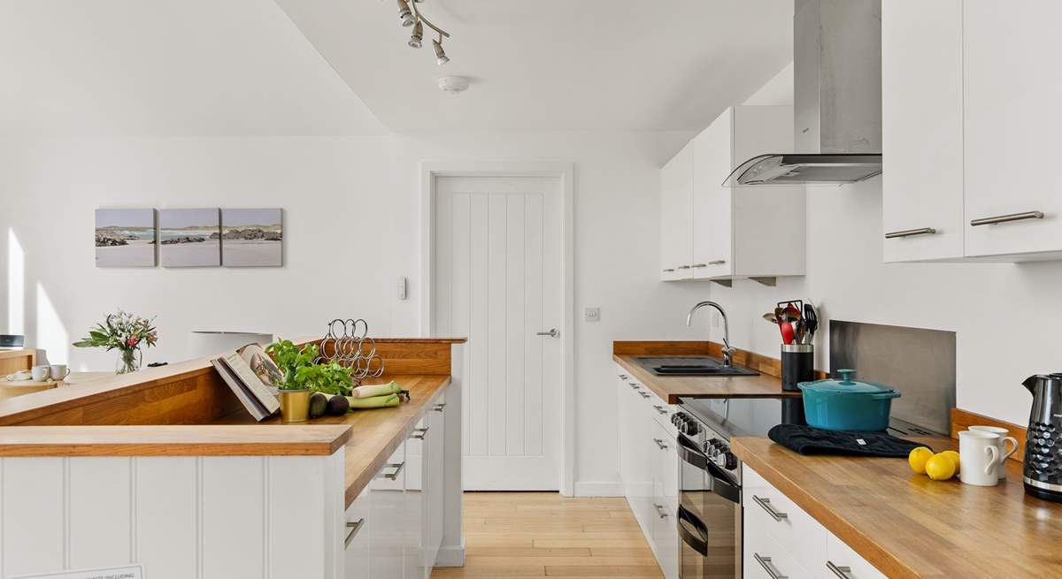 The open plan kitchen is equipped and ready to whip up a family banquet.  