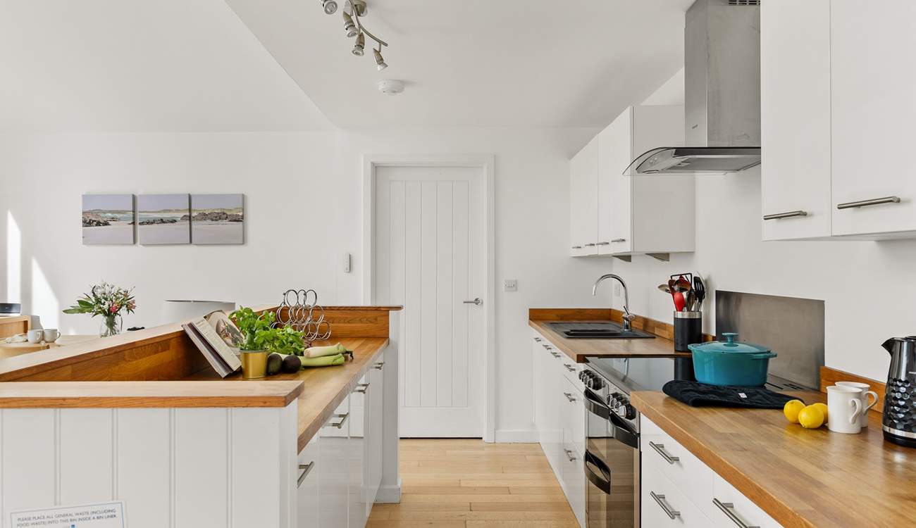 The open plan kitchen is equipped and ready to whip up a family banquet.  