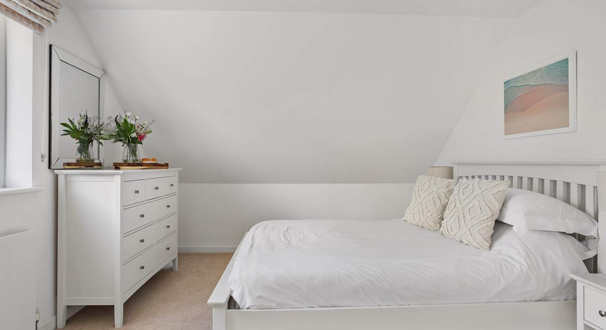 The spacious bedroom - please note the sloping ceiling.