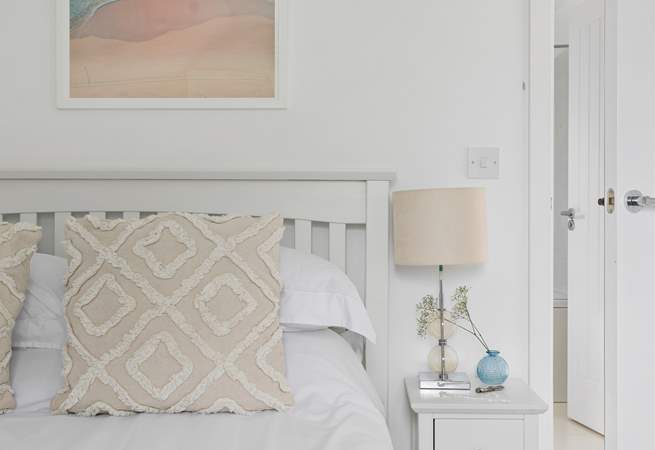 Relax with calming tones and lovely linens.