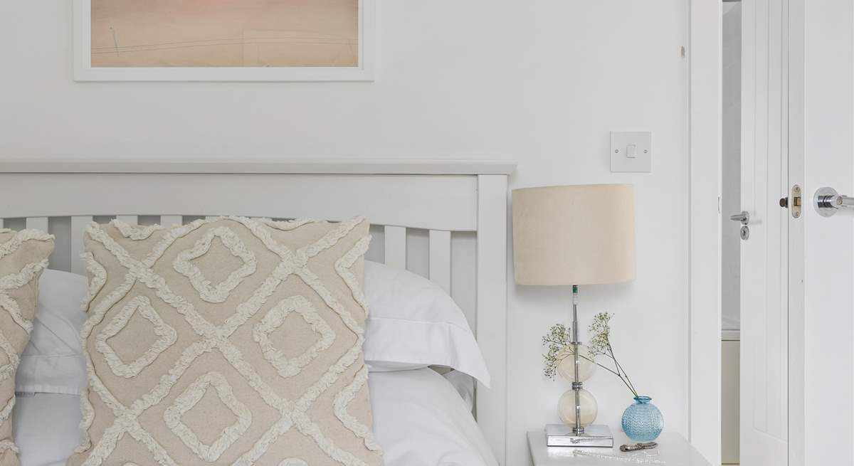 Relax with calming tones and lovely linens.