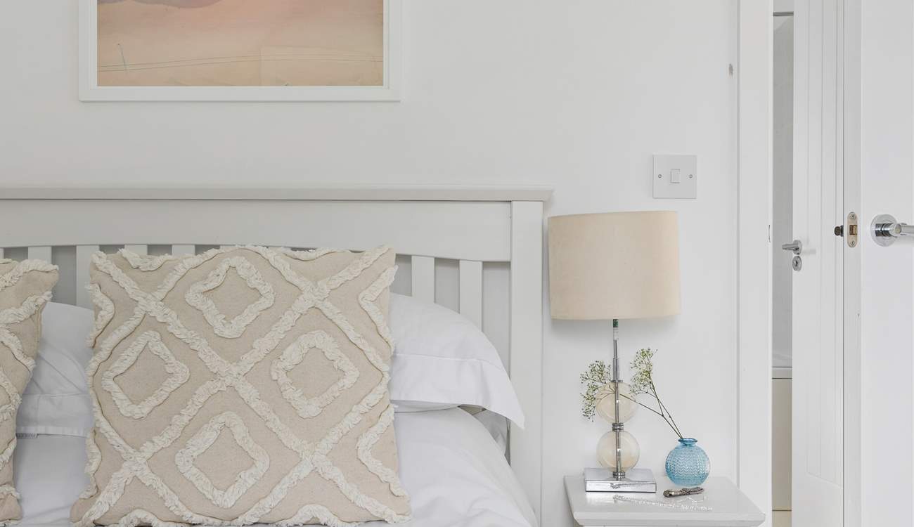 Relax with calming tones and lovely linens.