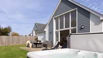 Head back outside to the large back garden with that all important hot tub.