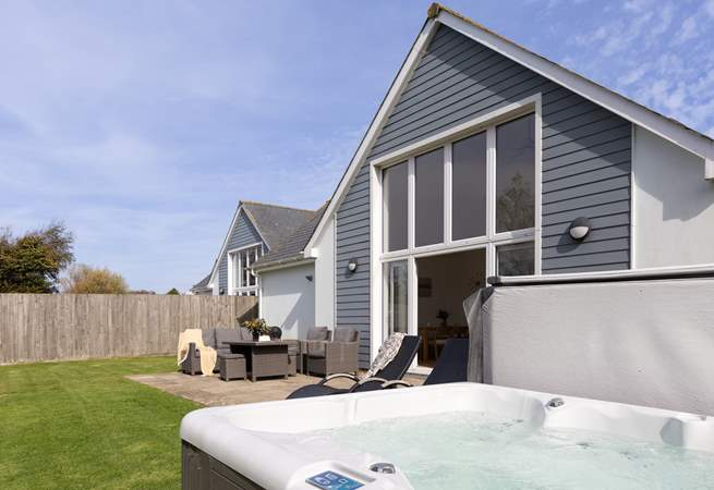 Head back outside to the large back garden with that all important hot tub.