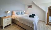 This bedroom is decorated in relaxing neutral shades.  - Thumbnail Image