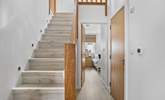Stairs lead to the first floor with three bedrooms and the family bathroom.  - Thumbnail Image