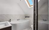 You can choose from a relaxing bath or a refreshing shower in the family bathroom. - Thumbnail Image