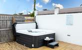 Enjoy a relaxing dip in the hot tub. - Thumbnail Image