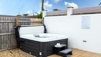 Enjoy a relaxing dip in the hot tub.