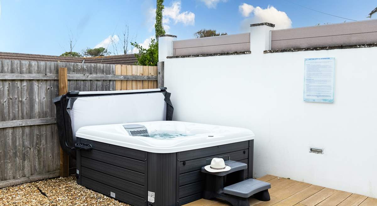 Enjoy a relaxing dip in the hot tub.