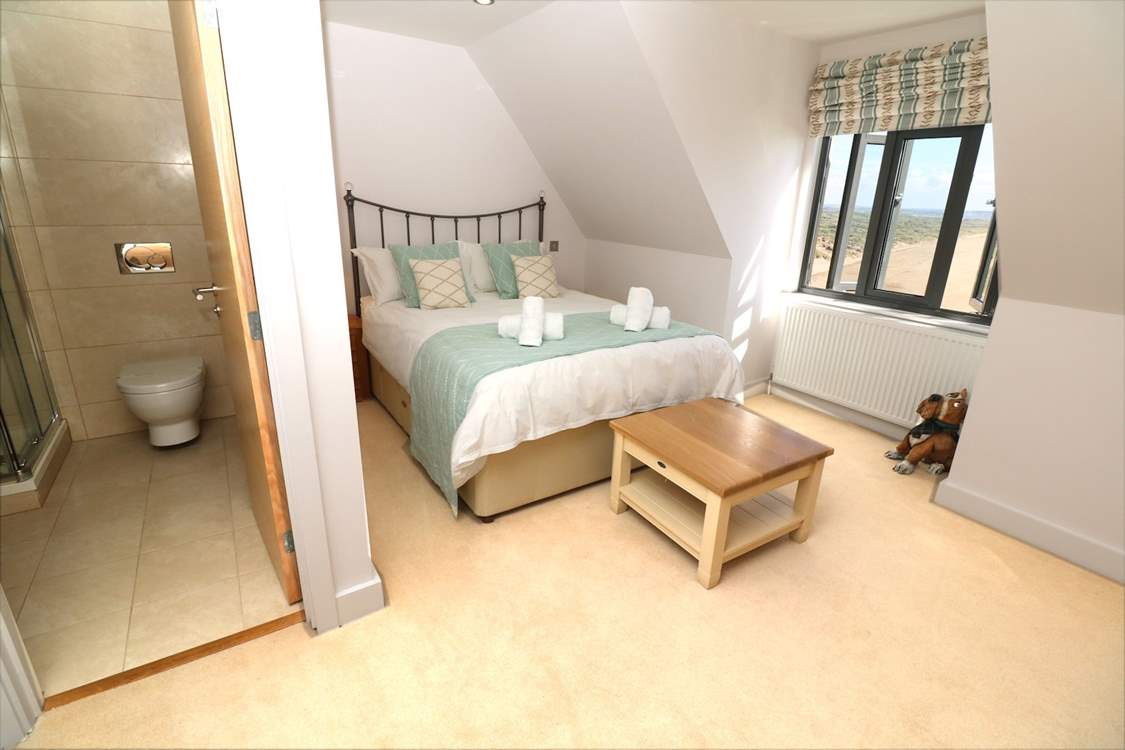 The gorgeous double room has an en suite shower-room and stunning views.