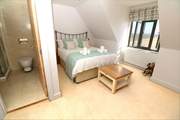 The gorgeous double room has an en suite shower-room and stunning views.
