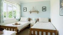 The pretty twin bedroom. 